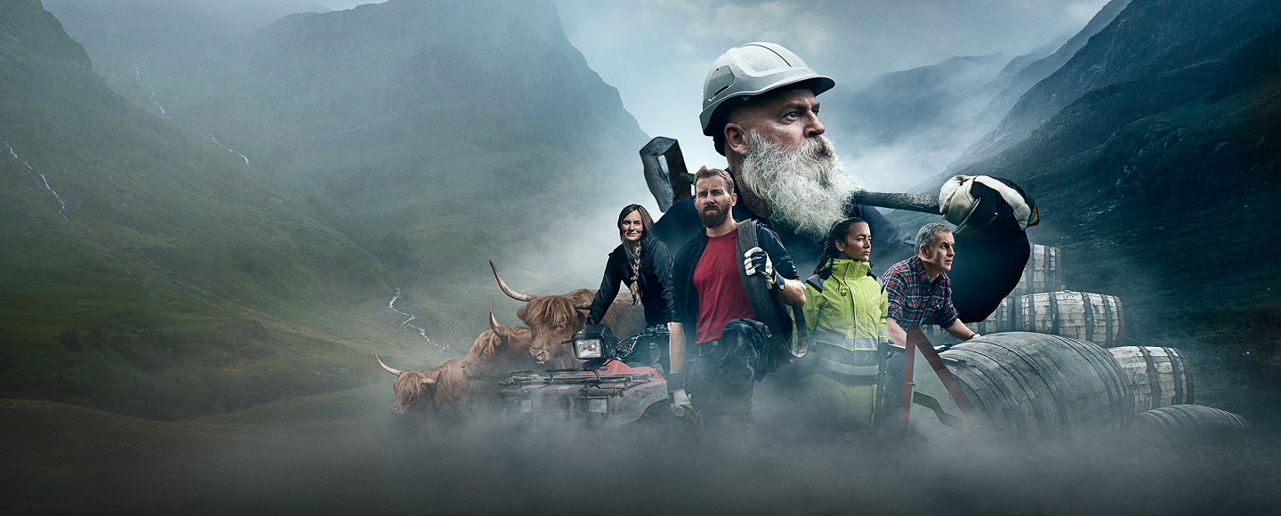 Group of people in workwear in a mountainous landscape